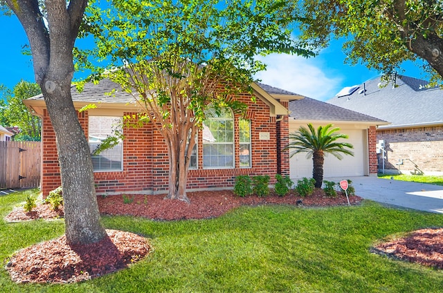 view of front facade featuring a garage and a front lawn