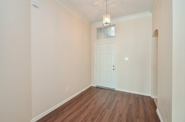 foyer with ornamental molding and dark wood-type flooring