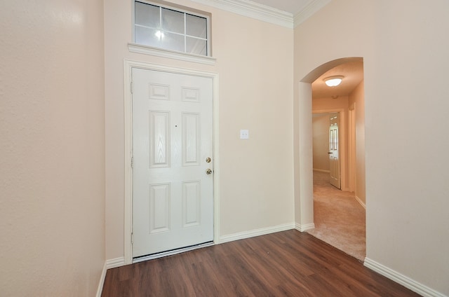 entrance foyer featuring dark hardwood / wood-style floors and ornamental molding