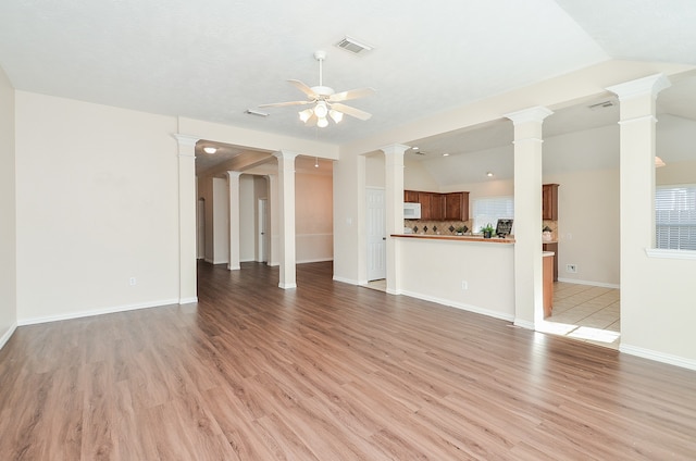 unfurnished living room with light hardwood / wood-style flooring, ceiling fan, and lofted ceiling