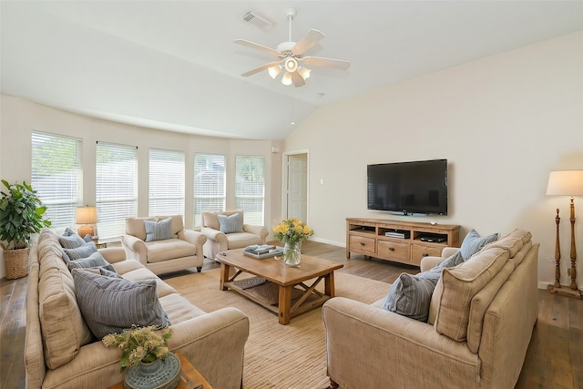 living room with light hardwood / wood-style flooring, a wealth of natural light, and lofted ceiling