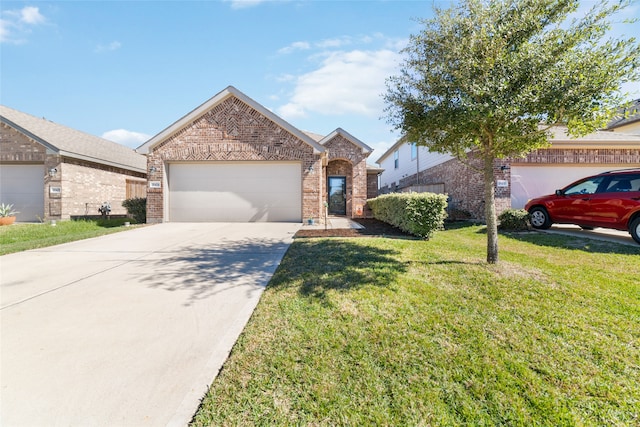 view of front of home with a garage and a front lawn