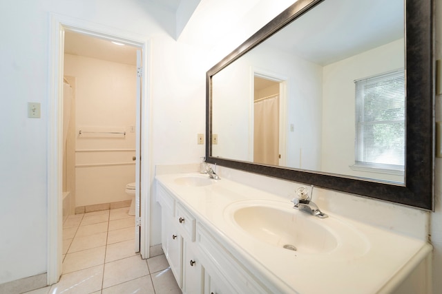 bathroom with tile patterned flooring, a shower with curtain, vanity, and toilet