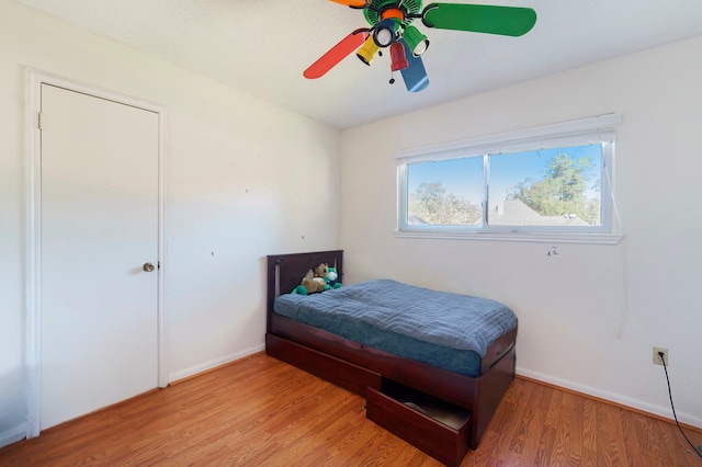 bedroom featuring ceiling fan and wood-type flooring