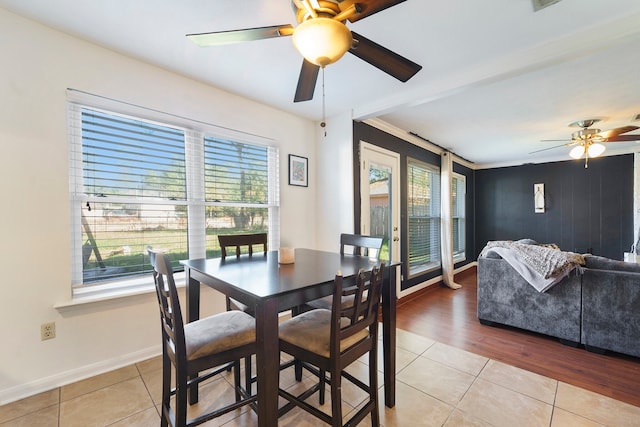 dining room with ceiling fan, a healthy amount of sunlight, light hardwood / wood-style floors, and ornamental molding