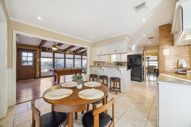 dining area with ceiling fan, beamed ceiling, ornamental molding, and billiards