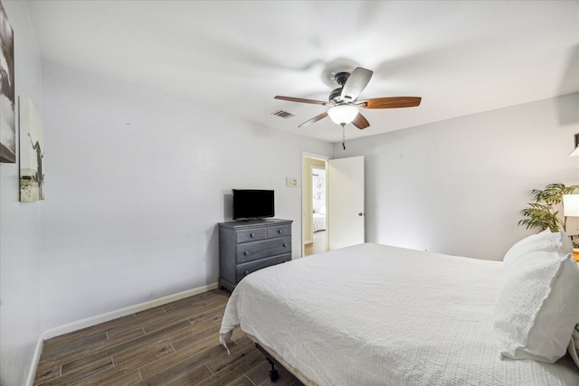 bedroom featuring ceiling fan and dark wood-type flooring