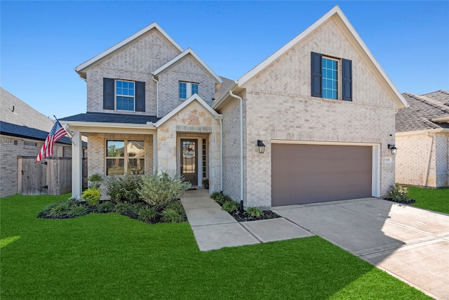 view of front of property with a front lawn and a garage