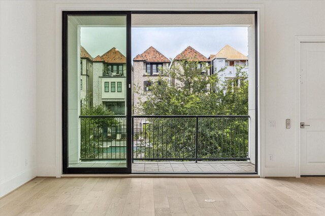 7523 Cuadro Ln, Houston, TX 77055 - doorway to outside with wood finished floors and baseboards