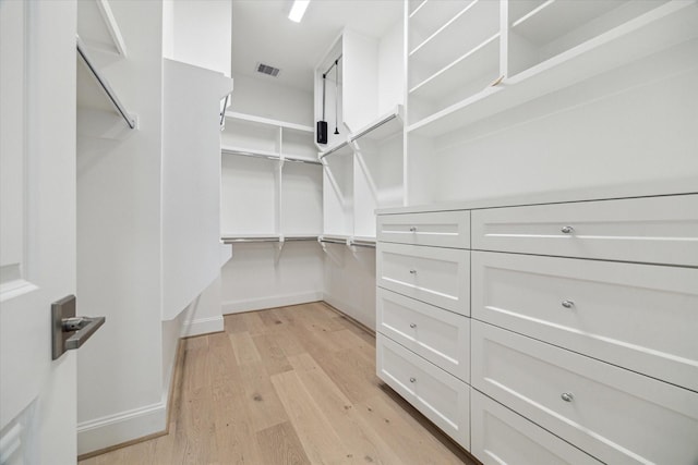 7523 Cuadro Ln, Houston, TX 77055 - walk in closet featuring light wood finished floors