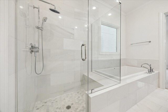7523 Cuadro Ln, Houston, TX 77055 - bathroom with a stall shower, a garden tub, and ornamental molding