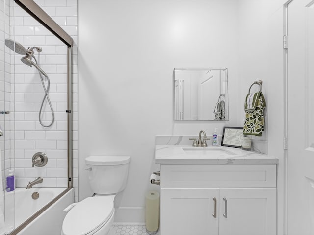 full bathroom featuring tile patterned floors, vanity, toilet, and enclosed tub / shower combo