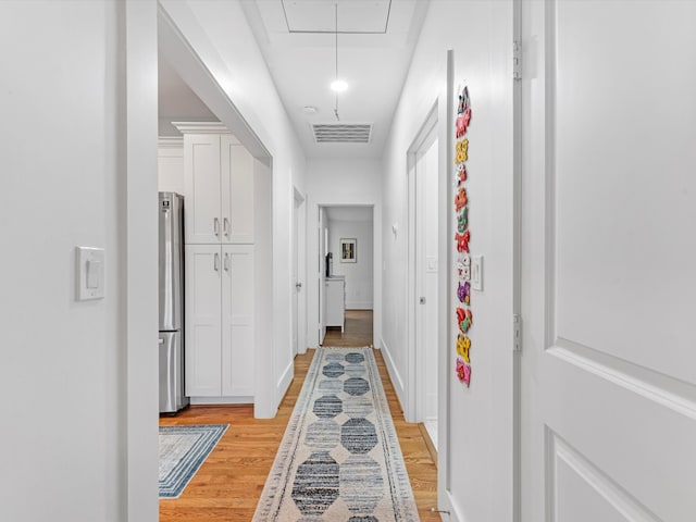 hallway featuring light wood-type flooring