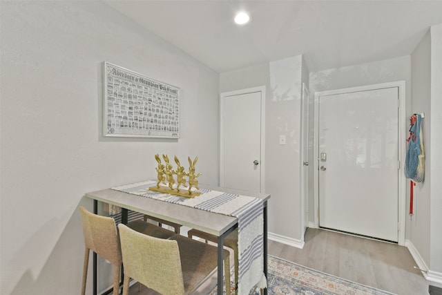 dining area featuring light wood-type flooring