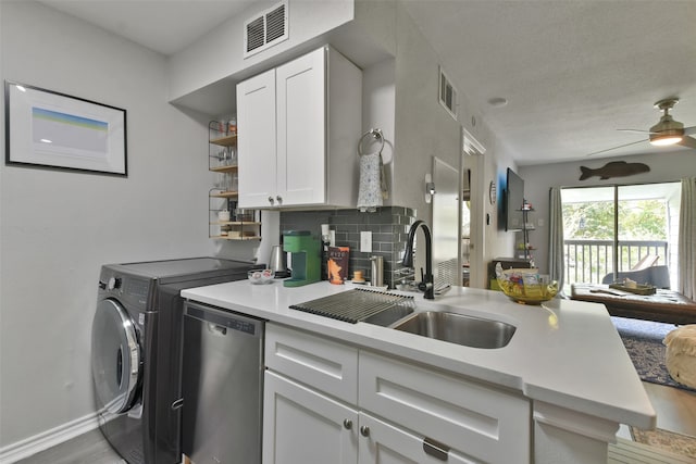 kitchen with white cabinets, sink, decorative backsplash, ceiling fan, and light wood-type flooring