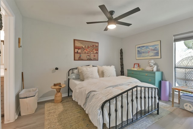 bedroom with ceiling fan and light wood-type flooring