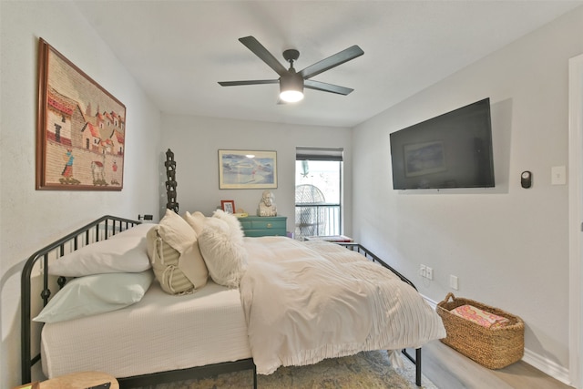 bedroom featuring wood-type flooring and ceiling fan