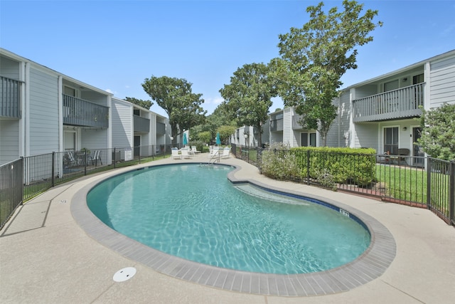 view of swimming pool with a patio area