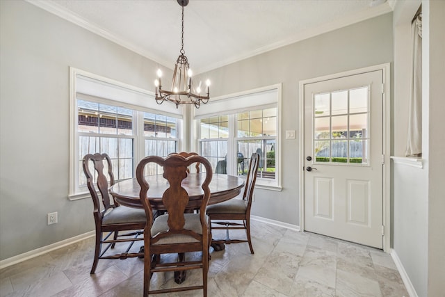 dining area featuring plenty of natural light, a notable chandelier, and ornamental molding