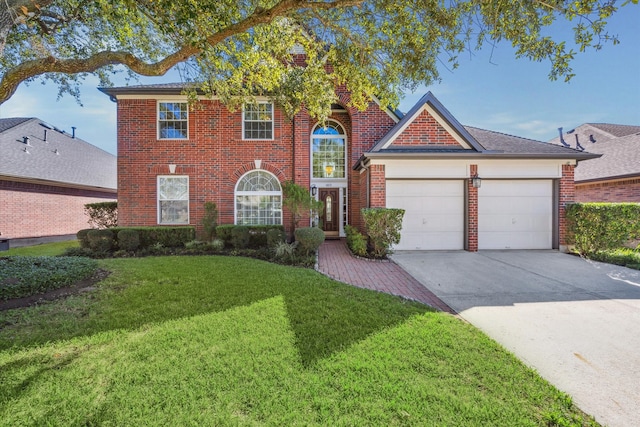 view of front facade featuring a front yard and a garage