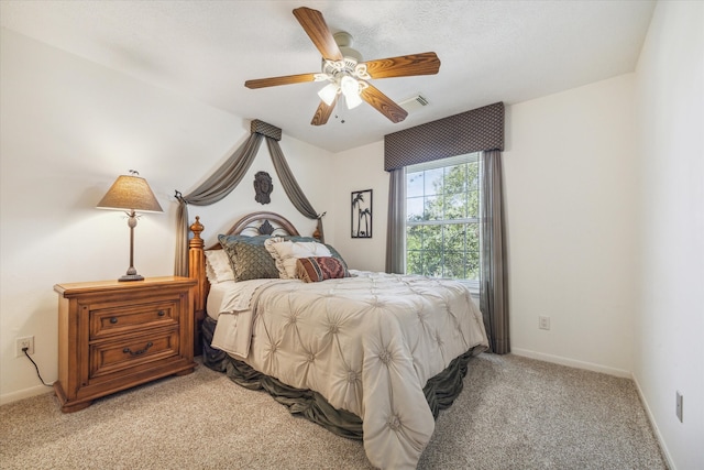 bedroom with ceiling fan and light colored carpet