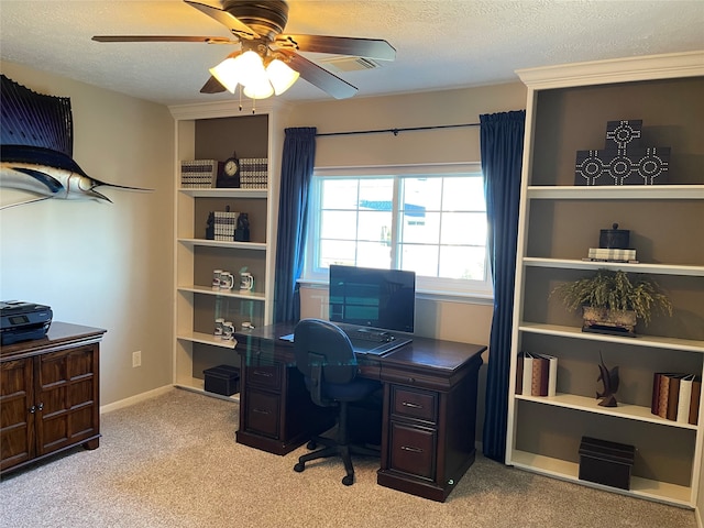 office area with light carpet, a textured ceiling, and ceiling fan