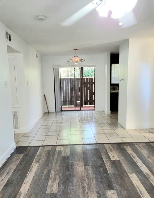 unfurnished room featuring ceiling fan and light wood-type flooring