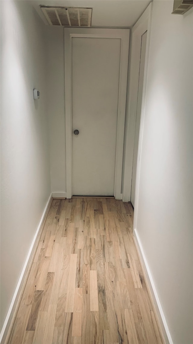 corridor featuring light hardwood / wood-style floors