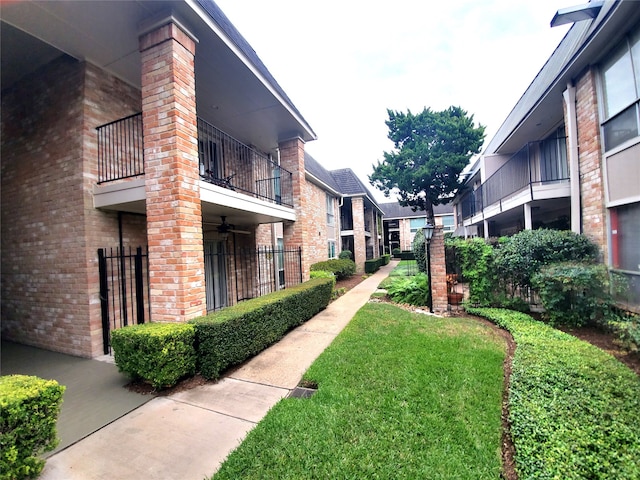 view of home's community with a yard