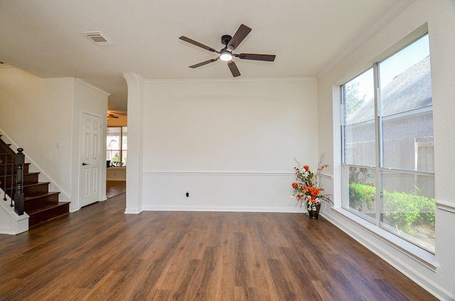 unfurnished room featuring crown molding, dark wood-type flooring, and ceiling fan