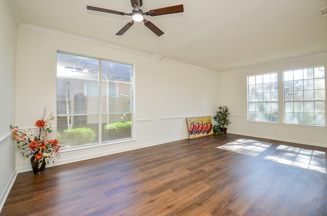 spare room with crown molding, ceiling fan, and dark hardwood / wood-style flooring