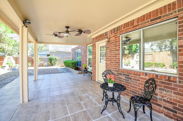 view of patio featuring ceiling fan