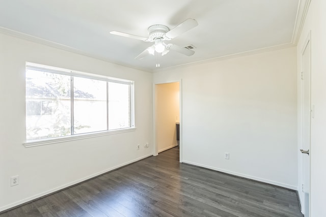 unfurnished room featuring dark hardwood / wood-style flooring, ceiling fan, and crown molding