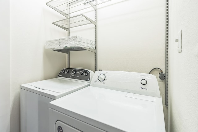 laundry room with independent washer and dryer