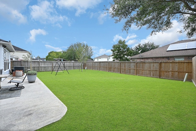 view of yard with a playground and a patio area