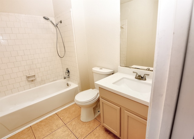 full bathroom featuring vanity, tile patterned flooring, tiled shower / bath, and toilet