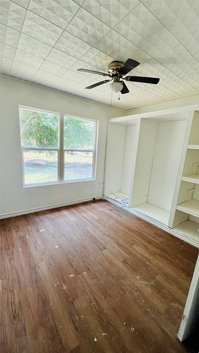 spare room with plenty of natural light and wood-type flooring