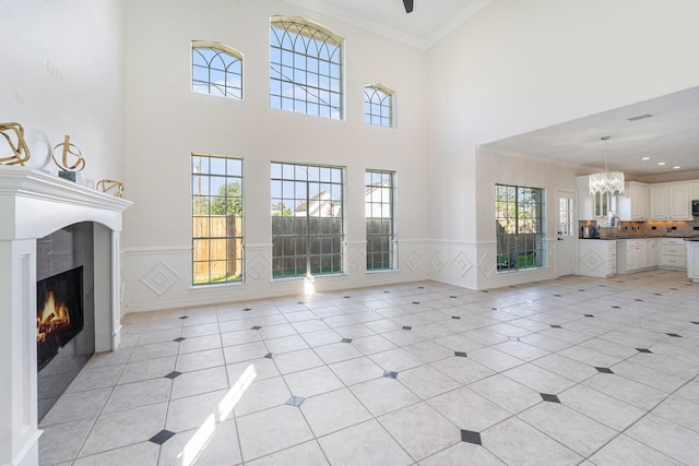 8215 Arrowhead Ln, Houston, TX 77075 - unfurnished living room with ornamental molding, a lit fireplace, light tile patterned flooring, a sink, and wainscoting