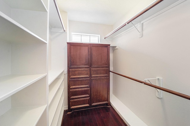 8215 Arrowhead Ln, Houston, TX 77075 - walk in closet featuring dark wood-style floors