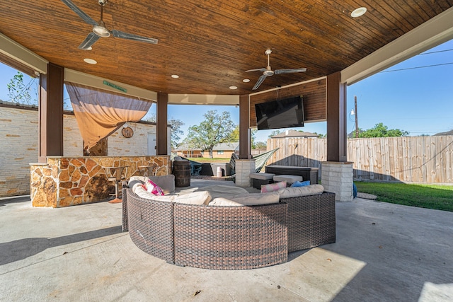 view of patio / terrace with ceiling fan, an outdoor hangout area, and an outdoor bar