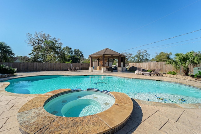 8215 Arrowhead Ln, Houston, TX 77075 - view of swimming pool featuring a gazebo, a pool with connected hot tub, a patio area, and a fenced backyard