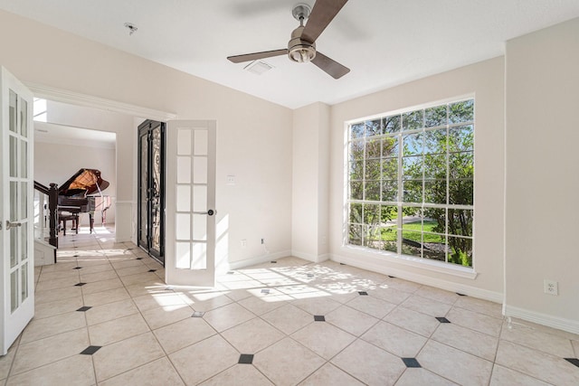8215 Arrowhead Ln, Houston, TX 77075 - empty room featuring french doors, light tile patterned floors, ceiling fan, lofted ceiling, and baseboards