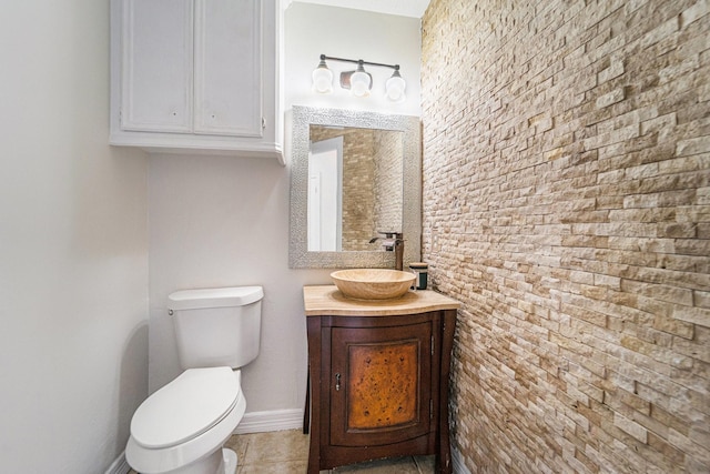 8215 Arrowhead Ln, Houston, TX 77075 - half bathroom featuring vanity, toilet, tile patterned flooring, and baseboards