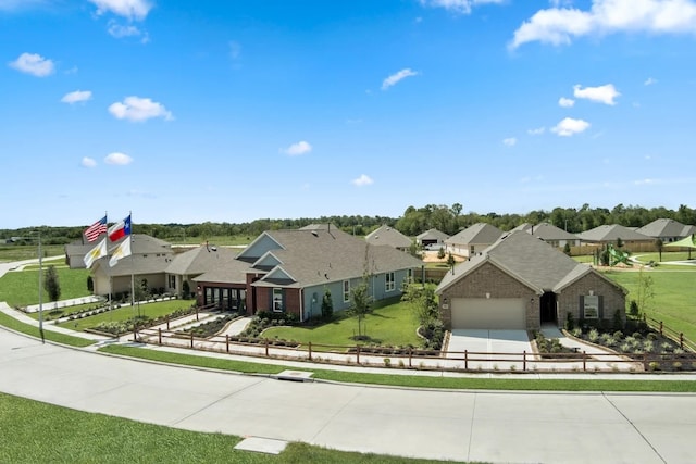 ranch-style house featuring a garage and a front lawn