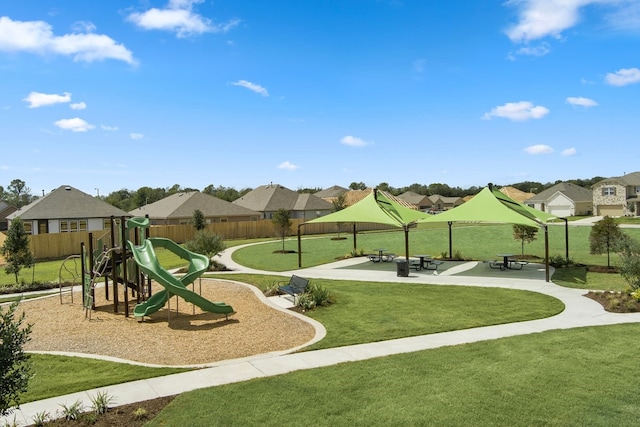 676 Imperial Loop, Alvin, TX 77511 - community jungle gym featuring fence, a yard, and a residential view