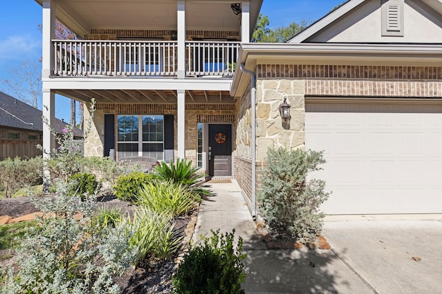 view of front of property featuring a garage and a balcony