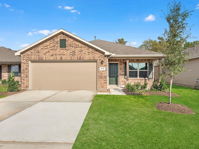 view of front of home with a garage and a front lawn