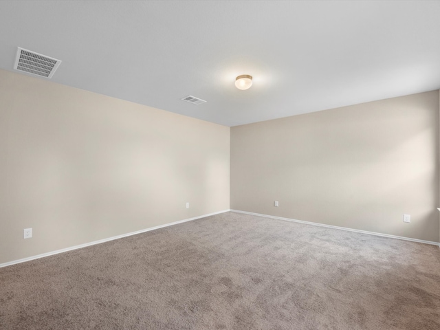 unfurnished room featuring carpet