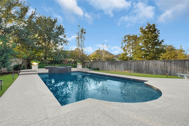 view of pool featuring a patio