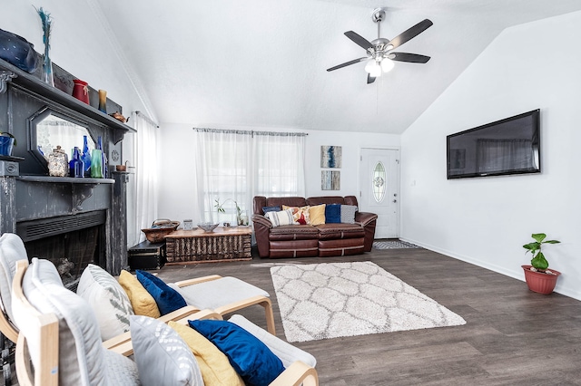 living room featuring ceiling fan, dark hardwood / wood-style flooring, and vaulted ceiling